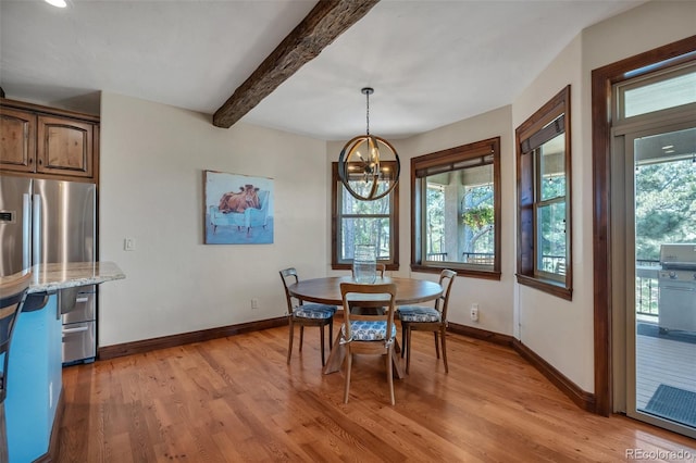 19336 Queens Crescent Way, Monument, CO 80132 - dining area with light wood-style flooring, baseboards, beam ceiling, and a chandelier