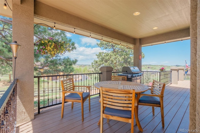 19336 Queens Crescent Way, Monument, CO 80132 - wooden terrace featuring area for grilling and outdoor dining area