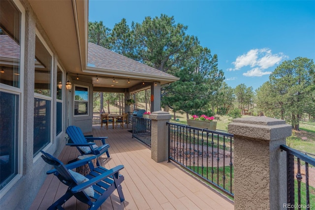 19336 Queens Crescent Way, Monument, CO 80132 - wooden deck with outdoor dining space