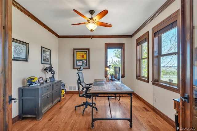 19336 Queens Crescent Way, Monument, CO 80132 - home office featuring light wood-style floors, baseboards, a ceiling fan, and crown molding