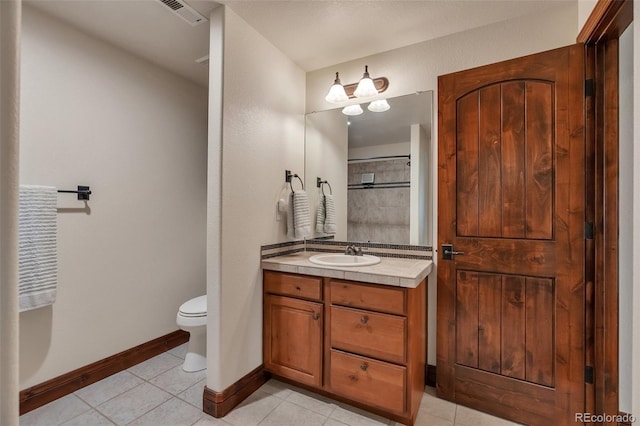19336 Queens Crescent Way, Monument, CO 80132 - full bathroom with tile patterned flooring, toilet, vanity, and baseboards