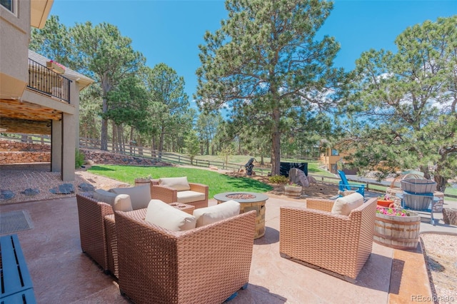 19336 Queens Crescent Way, Monument, CO 80132 - view of patio / terrace with an outdoor living space with a fire pit