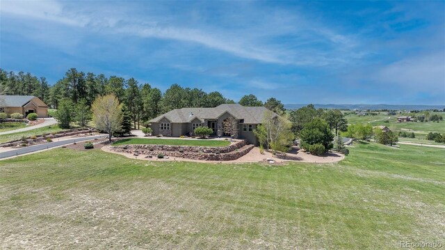 19336 Queens Crescent Way, Monument, CO 80132 - view of front facade with an attached garage and a front yard