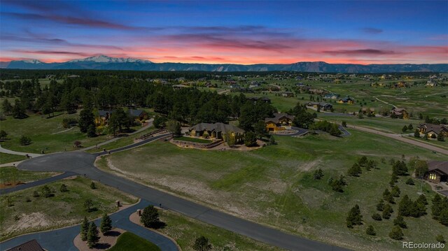 19336 Queens Crescent Way, Monument, CO 80132 - aerial view at dusk of a mountain view