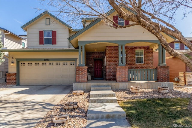 view of front facade with brick siding, a porch, an attached garage, and driveway