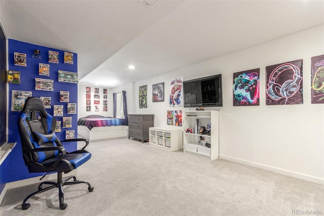 carpeted bedroom featuring baseboards