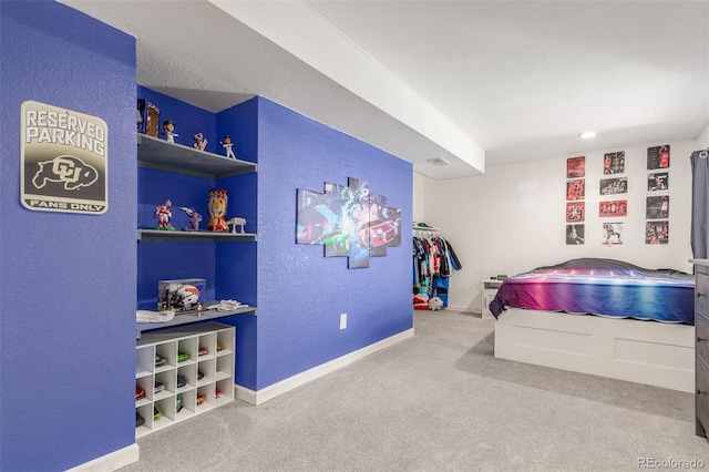 carpeted bedroom with baseboards