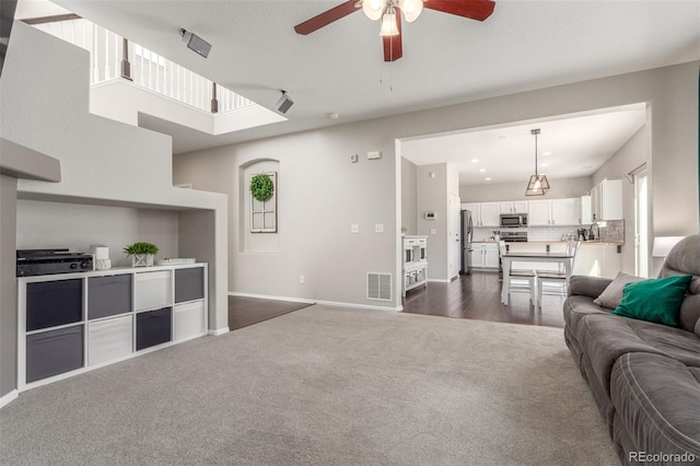 living room with visible vents, a ceiling fan, recessed lighting, dark colored carpet, and baseboards