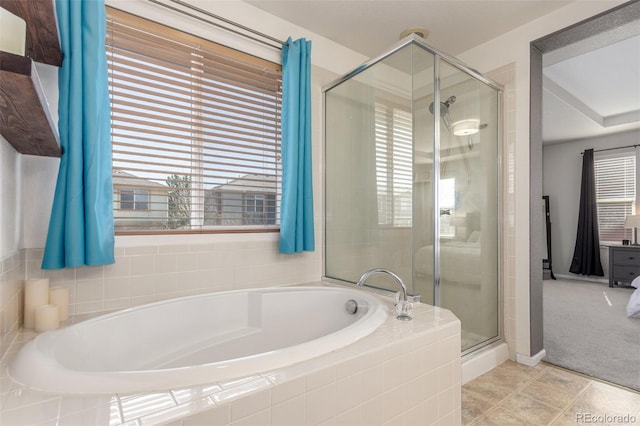 bathroom with a bath, tile patterned flooring, and a shower stall