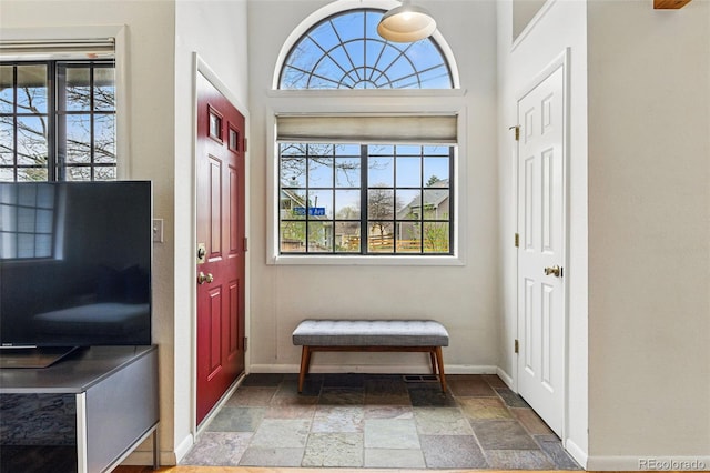 3105 Galileo Ln, Boulder, CO 80301 - entrance foyer featuring stone tile floors, healthy amount of natural light, and baseboards
