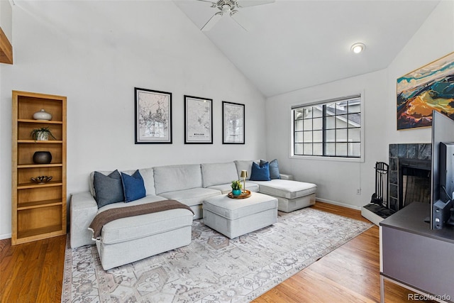 3105 Galileo Ln, Boulder, CO 80301 - living room featuring a ceiling fan, high vaulted ceiling, wood finished floors, a premium fireplace, and baseboards