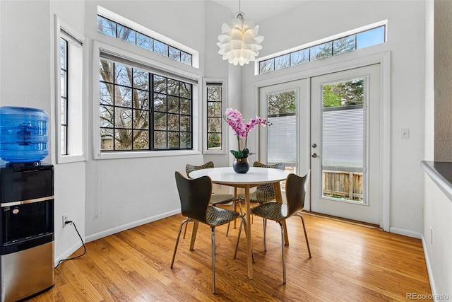 3105 Galileo Ln, Boulder, CO 80301 - dining space with plenty of natural light, light wood-style flooring, baseboards, and a high ceiling