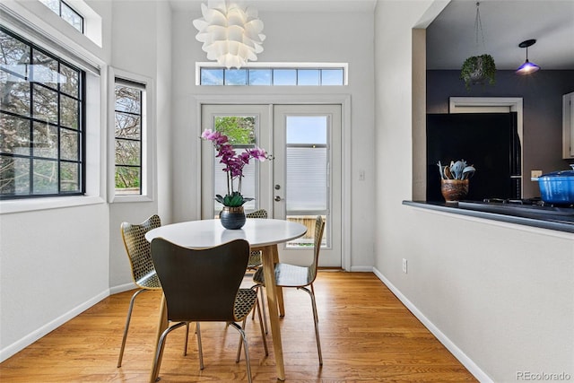 3105 Galileo Ln, Boulder, CO 80301 - dining space featuring light wood finished floors, a chandelier, and baseboards