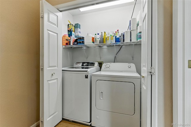 3105 Galileo Ln, Boulder, CO 80301 - laundry area with washing machine and clothes dryer and light wood-type flooring
