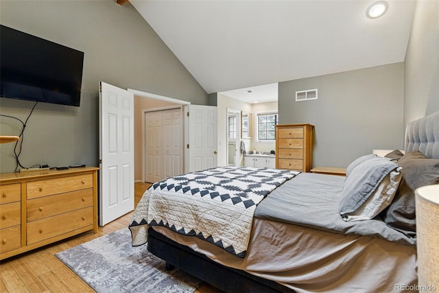 3105 Galileo Ln, Boulder, CO 80301 - bedroom with high vaulted ceiling, light wood-style floors, and a closet