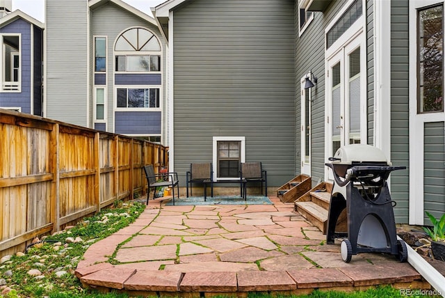 3105 Galileo Ln, Boulder, CO 80301 - fenced backyard featuring a patio area, entry steps, grilling area, and french doors