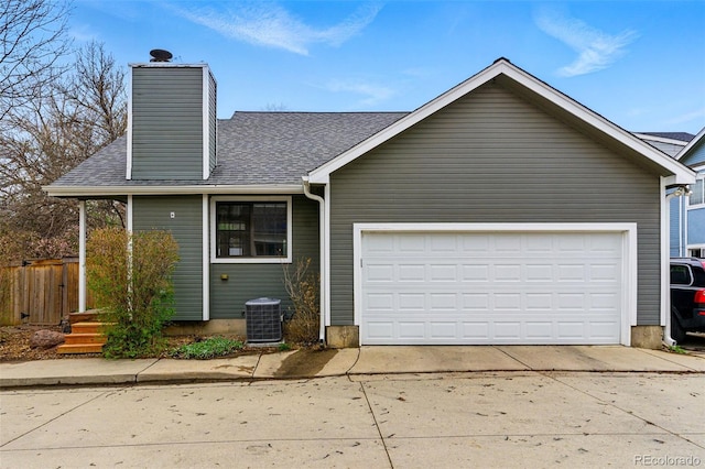 3105 Galileo Ln, Boulder, CO 80301 - view of front facade featuring a shingled roof, a chimney, an attached garage, concrete driveway, and central air condition unit
