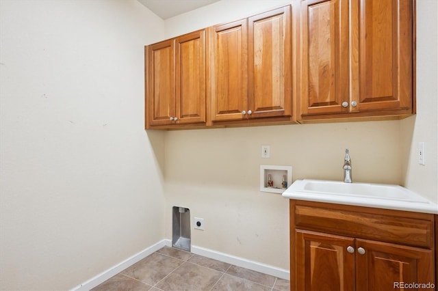 5603 Van Bibber Ct, Golden, CO 80403 - laundry room featuring washer hookup, cabinet space, electric dryer hookup, and light tile patterned flooring