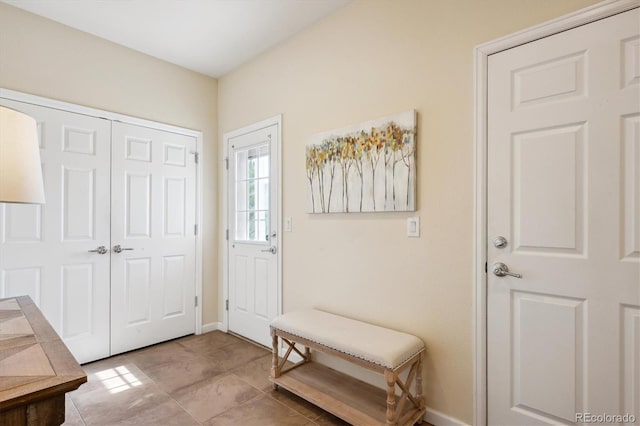 5603 Van Bibber Ct, Golden, CO 80403 - tiled entryway featuring baseboards