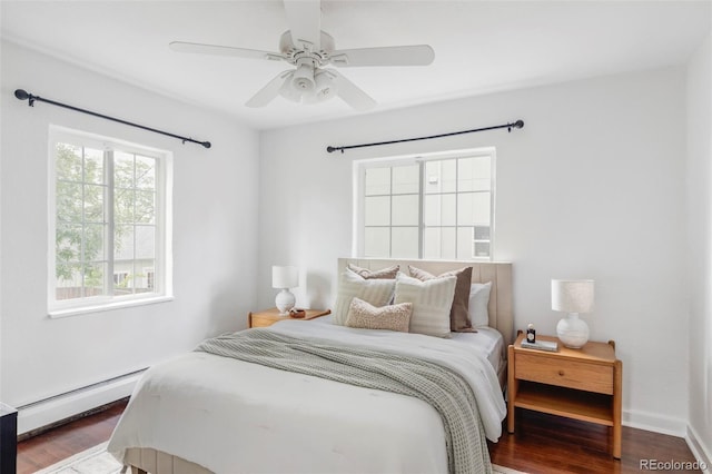 2895 S Sherman St, Englewood, CO 80113 - bedroom with a baseboard heating unit, wood finished floors, and a ceiling fan