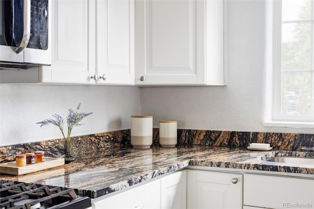 2895 S Sherman St, Englewood, CO 80113 - kitchen featuring stainless steel microwave and white cabinets