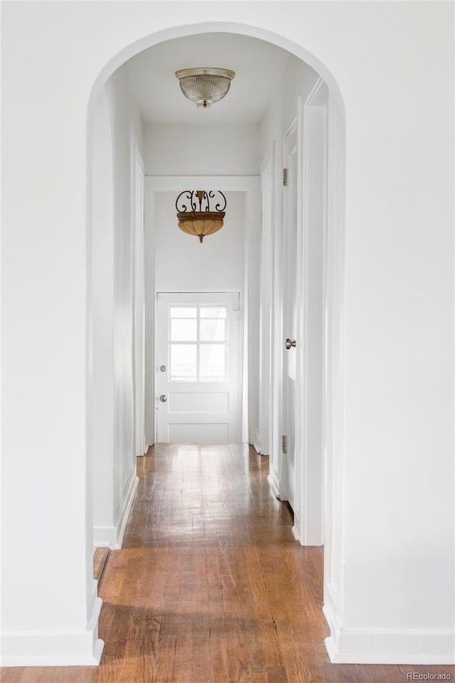 2895 S Sherman St, Englewood, CO 80113 - corridor featuring wood finished floors and arched walkways