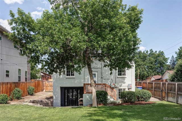 2895 S Sherman St, Englewood, CO 80113 - rear view of house featuring stucco siding and a fenced backyard