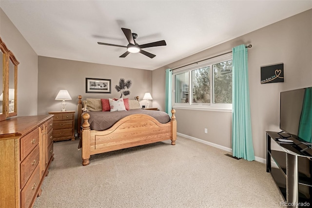 bedroom with light carpet and ceiling fan