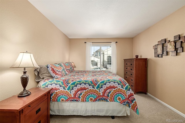 bedroom featuring light carpet