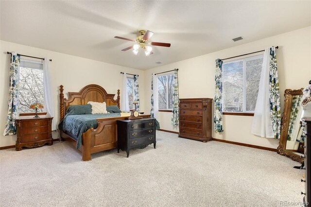 1831 Ashford Cir, Longmont, CO 80504 - bedroom featuring light colored carpet, multiple windows, and baseboards