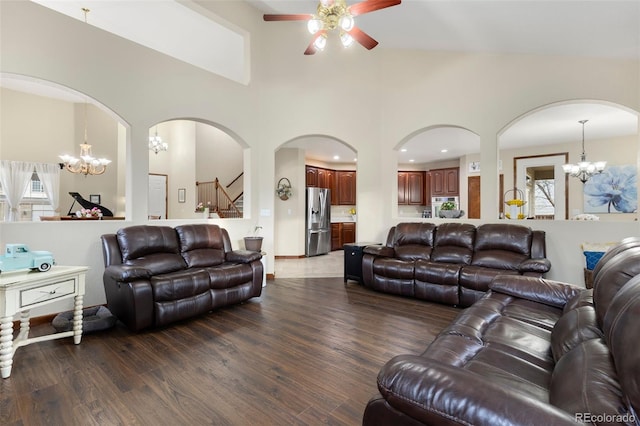 1831 Ashford Cir, Longmont, CO 80504 - living area with a ceiling fan, a chandelier, wood finished floors, healthy amount of natural light, and a high ceiling
