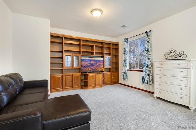1831 Ashford Cir, Longmont, CO 80504 - living room featuring light carpet and baseboards