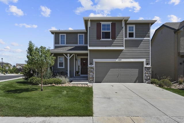 view of front of property featuring a garage and a front yard