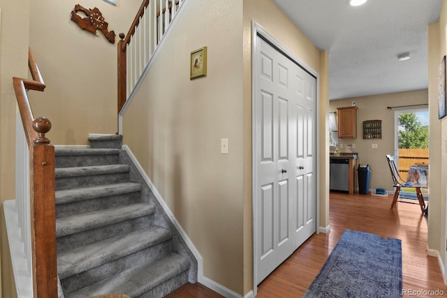 stairway with wood-type flooring