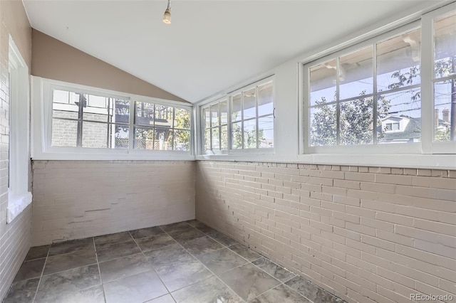 unfurnished sunroom with lofted ceiling