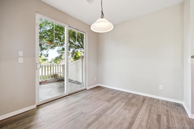 10480 Truckee St Unit B, Commerce City, CO 80022 - spare room featuring wood finished floors and baseboards