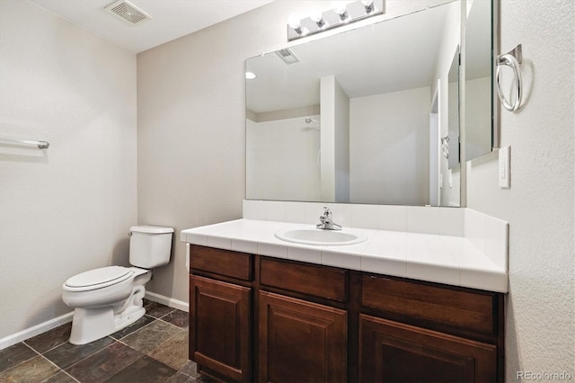 10480 Truckee St Unit B, Commerce City, CO 80022 - bathroom with vanity and stone finish floors