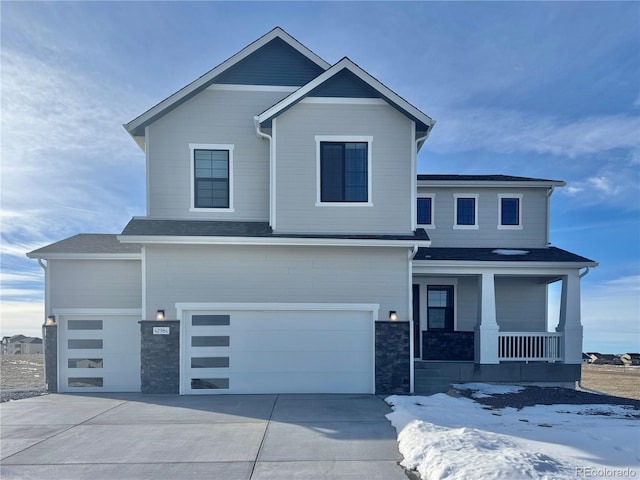 view of front of property featuring a porch and a garage