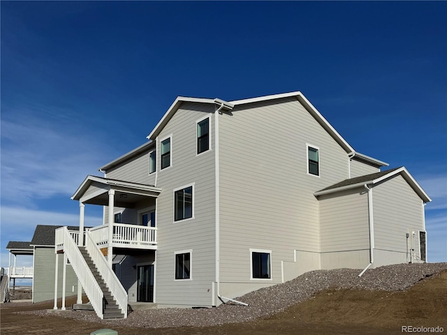 view of side of home with stairs