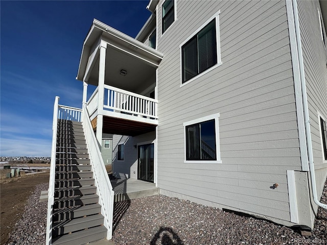 view of side of property with a patio area