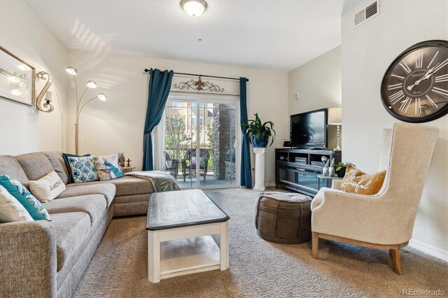 carpeted living room with baseboards and visible vents