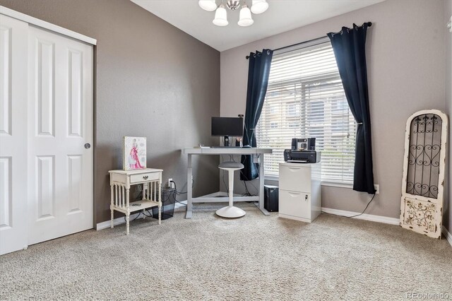 office featuring an inviting chandelier, baseboards, plenty of natural light, and carpet flooring