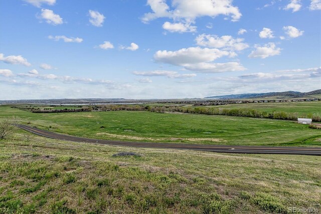 drone / aerial view featuring a mountain view and a rural view