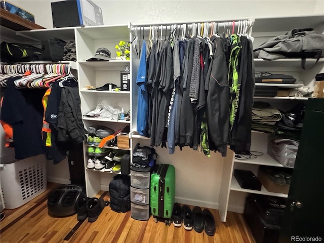 spacious closet with wood finished floors