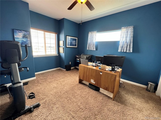 office featuring a ceiling fan, a healthy amount of sunlight, and carpet