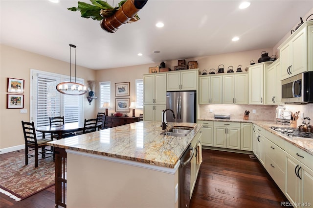 16 Willowcroft Dr, Littleton, CO 80123 - kitchen featuring stainless steel appliances, a chandelier, dark wood-style flooring, light stone counters, and recessed lighting