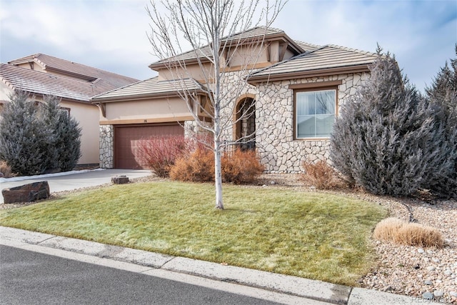 16 Willowcroft Dr, Littleton, CO 80123 - view of front of home with stone siding, a garage, stucco siding, and a front lawn