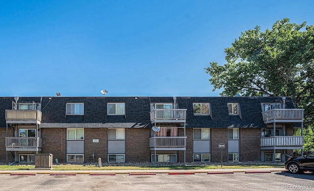 309 E Highline Cir Unit 102, Centennial, CO 80122 - view of apartment building / complex featuring uncovered parking