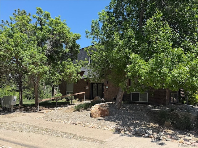 309 E Highline Cir Unit 102, Centennial, CO 80122 - view of property hidden behind natural elements with brick siding