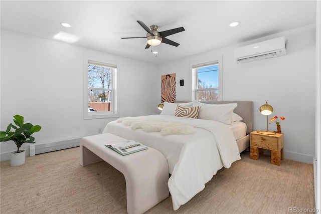 bedroom featuring multiple windows, ceiling fan, light colored carpet, and a wall mounted air conditioner